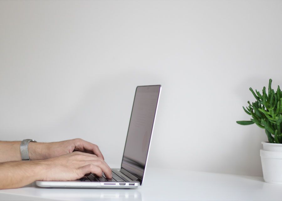 Developer typing on a laptop